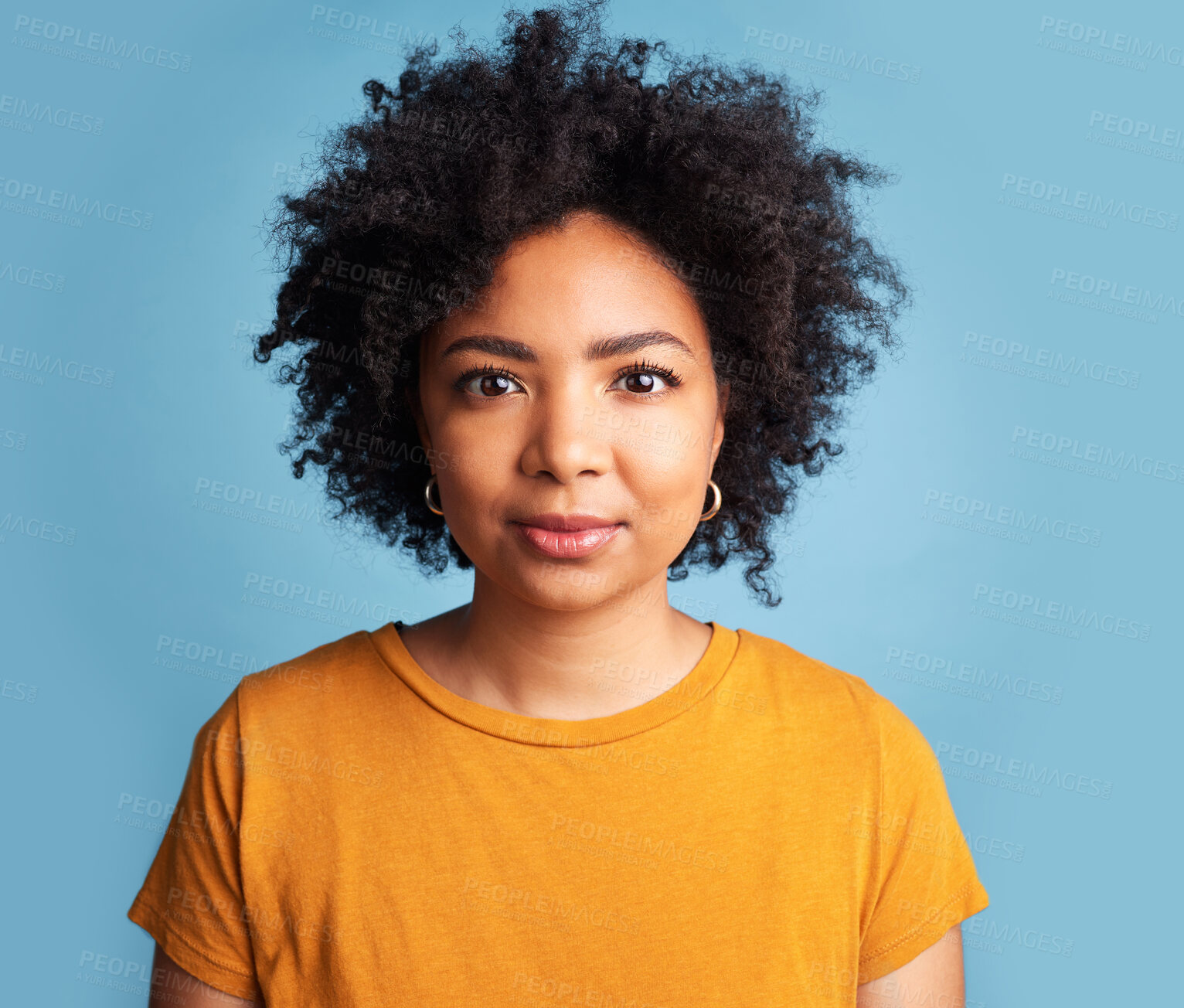 Buy stock photo Black woman, portrait of calm face on blue background in studio with natural beauty, confidence and serious mindset. College student and girl with a healthy afro or African haircare of young person