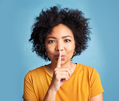 Buy stock photo Secret, quiet and shush with portrait of woman in studio for noise, privacy and gossip. Communication, announcement and whisper with face of person on blue background for voice, sign and rumor