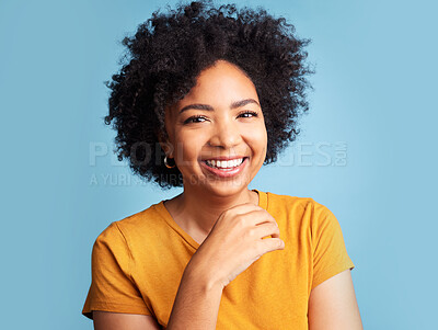 Buy stock photo Happy, smile and portrait of a woman in a studio with a positive, good and confident mindset. Happiness, excited and headshot of a young female model with an afro from Colombia by a blue background.