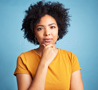Buy stock photo Portrait, serious and woman with a decision, focus and girl against a blue studio background. Face, female person or model with problem solving, solution or fantasy with future, assertive or question
