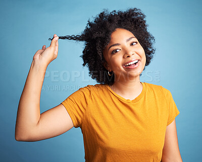Buy stock photo Happy, portrait and a young woman with curly hair in studio with a smile and cosmetics. Face of an african female person with afro hairstyle, natural beauty and confidence on a blue background