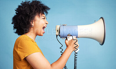 Buy stock photo Megaphone, voice and young woman for human rights, racism and equality, freedom of speech, strong opinion or fight, African person protest, call to action or change and justice on a blue background
