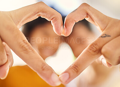 Buy stock photo Hands, heart sign and closeup in home with couple, love or icon for romance, care or bonding. People, fingers and partnership for support, emoji or together for pride in house with blurred background