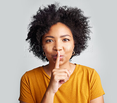 Buy stock photo Portrait, woman and secret with finger on lips for privacy, mystery and noise on white background. Face of female model, silence and shush for quiet, gossip or whisper emoji of confidential surprise