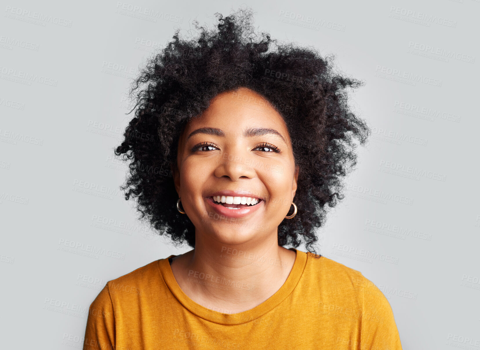 Buy stock photo Smile, woman and portrait in studio, white background and confident on backdrop. Face of happy young female model laughing with curly afro hair, positive personality and gen z style from South Africa