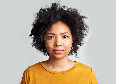 Buy stock photo Serious, woman and portrait in studio, white background and confident on backdrop. Face of young female model with curly hair, afro and cool attitude in casual fashion, style or gen z of South Africa