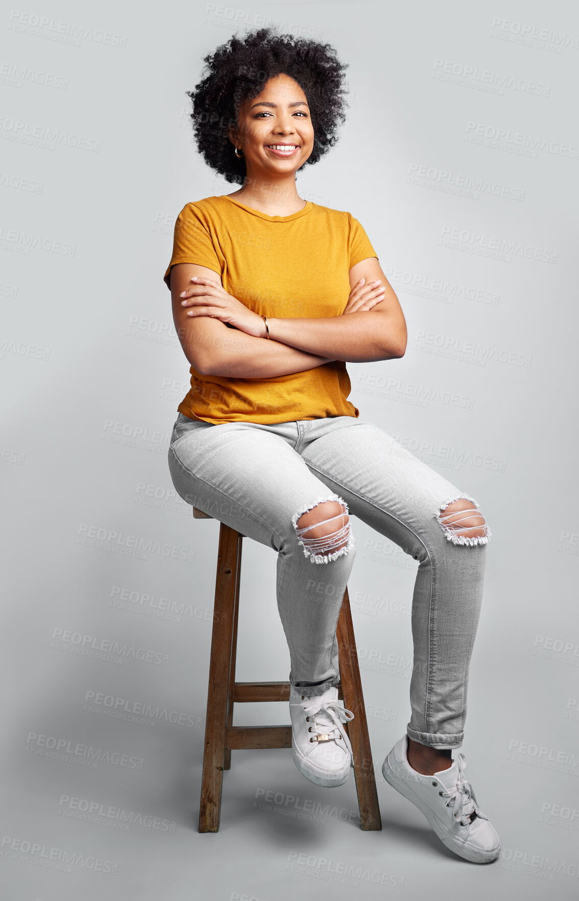 Buy stock photo Portrait, smile and woman with arms crossed on stool in studio isolated on a gray background. Chair, confidence and happy African female person from South Africa with stylish fashion, gen z or trendy