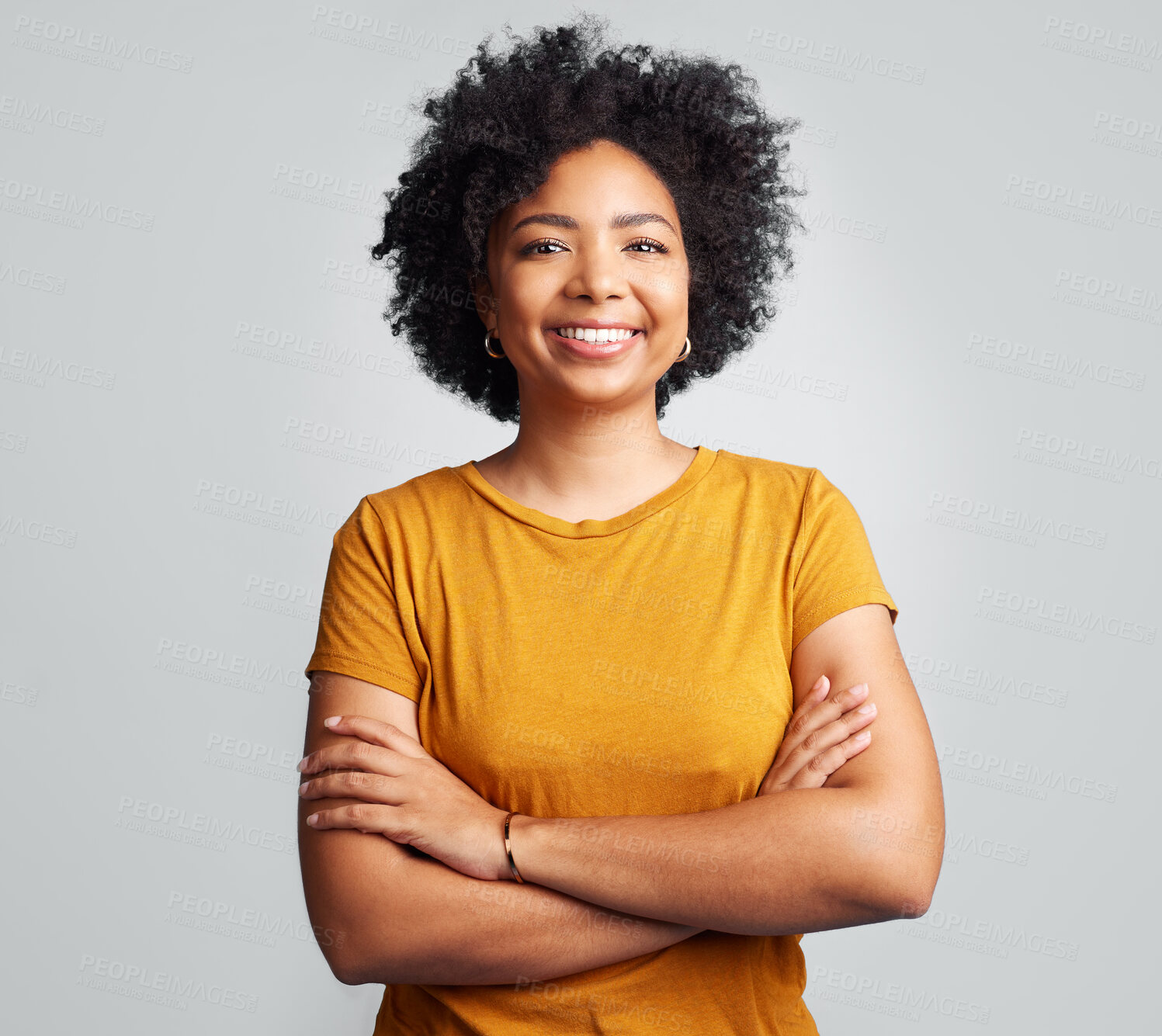 Buy stock photo Happy, woman and arms crossed for portrait in studio, white background and backdrop. Young female model, smile and natural curly afro hair with positive personality, gen z and girl of South Africa 
