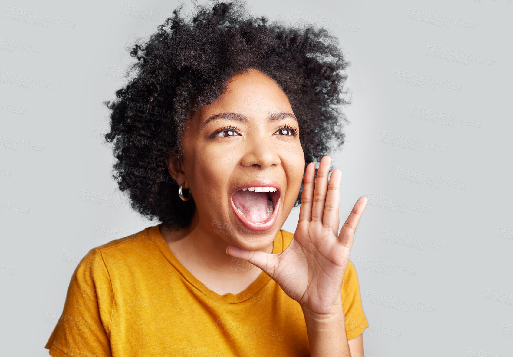 Buy stock photo Young woman and shouting or holding hand near wide open mouth or calling someone and yelling information on grey studio background. Loud, announcement and girl screaming interesting news