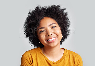 Buy stock photo Portrait, smile and happy woman in studio calm, relax and posing against a grey background space. Face, cheerful and excited African female confident, natural and content, casual and beautiful