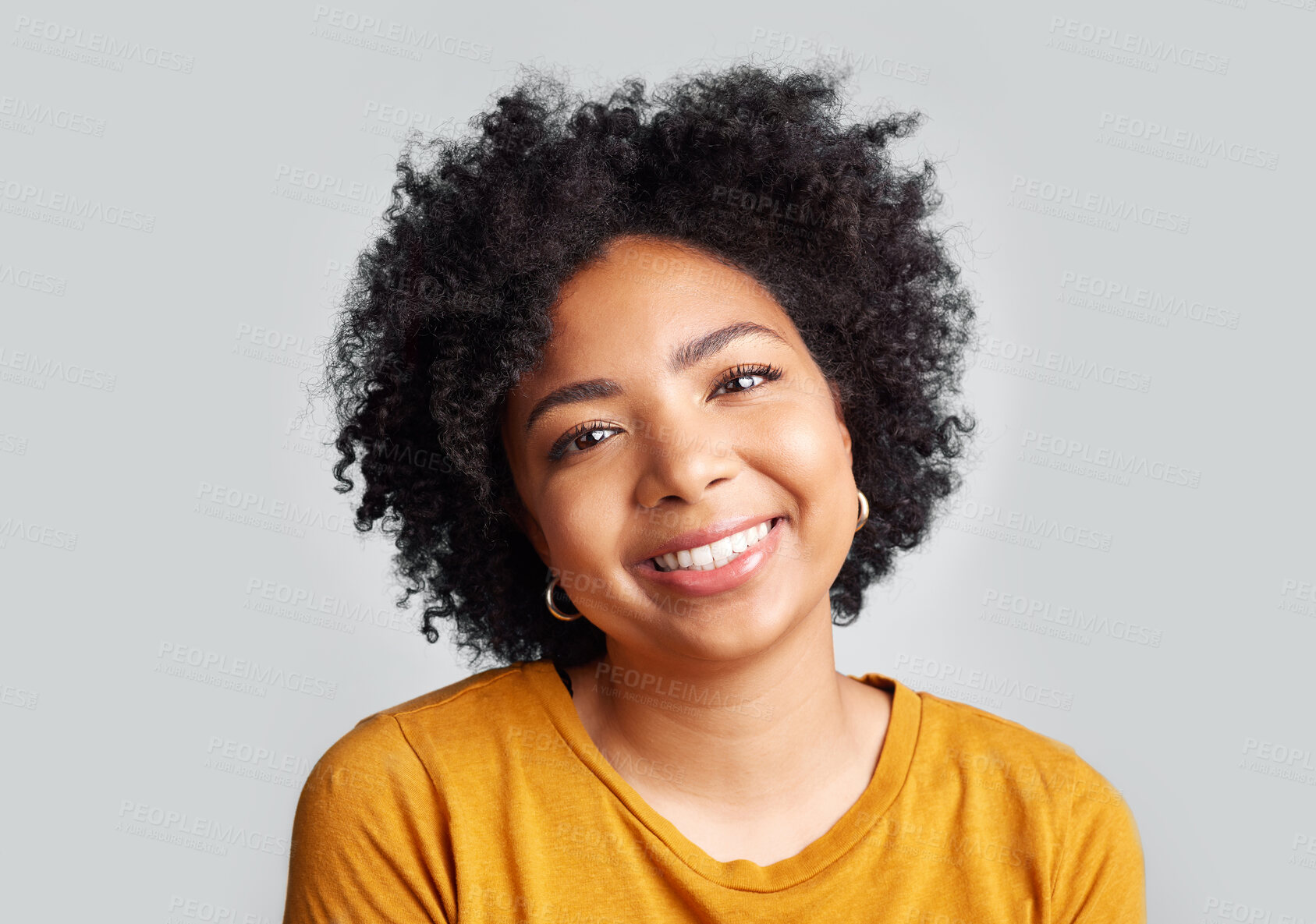 Buy stock photo Portrait, smile and happy woman in studio calm, relax and posing against a grey background space. Face, cheerful and excited African female confident, natural and content, casual and beautiful