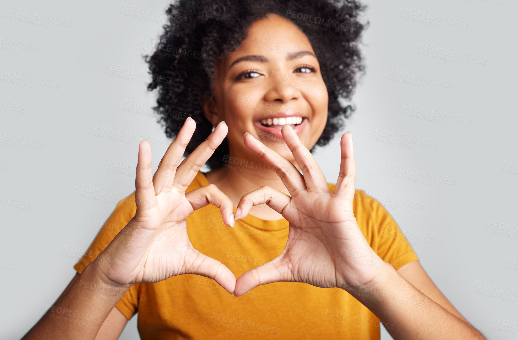 Buy stock photo Portrait of happy woman, heart and hand in studio, white background and care of kindness, emoji and icon. Young female model, love and finger shape with hands for thank you, trust and hope with smile