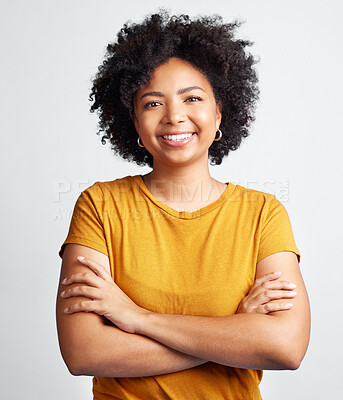 Buy stock photo Portrait of happy, woman, arms crossed and confident in studio, white background and backdrop. Young african female model smile with natural curly hair, positive face and gen z girl of South Africa