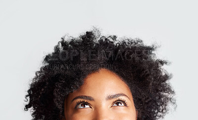 Buy stock photo Woman, eyes looking up and cropped in studio with thinking, ideas and hope by gray background. Young female model, african girl and think for mindset with afro, vision and daydream by backdrop
