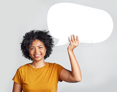 Buy stock photo Speech bubble, portrait and happy woman in studio with mockup, message and space on grey background. Banner, poster and African female with social media, news or announcement on isolated billboard