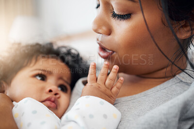 Buy stock photo Shot of a mother snuggling her baby girl