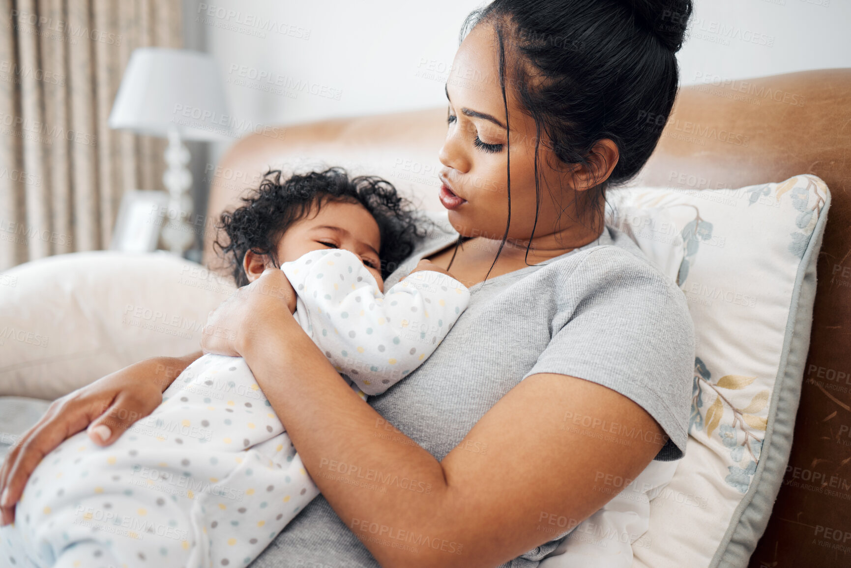 Buy stock photo Mother, baby and cuddle as love, support and nurture in family home or nursery for care for infant. Female person, childcare and comfort with hug, bonding together and embrace for safety or security