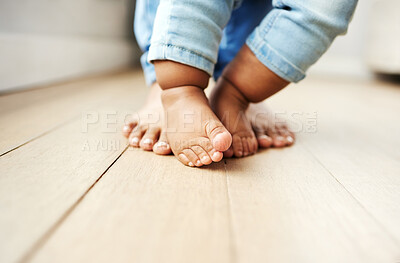 Buy stock photo Parent, kid and baby with feet for walking, child development or growth on floor at home. Closeup, guardian and toddler with toes for first steps, learning or teaching for movement, motion or support