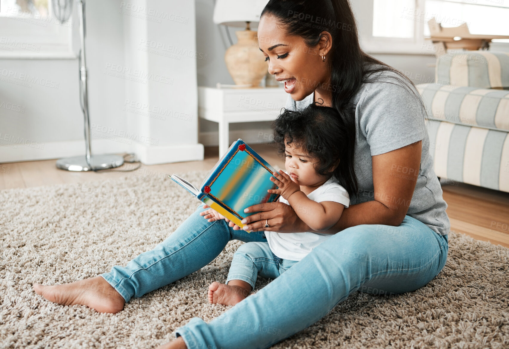 Buy stock photo Happy mom, baby and reading with book on floor for story, bonding or early childhood development at home. Mother, child or kid with smile for novel, learning or education in living room at house