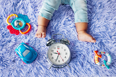 Buy stock photo Shot of a baby with their toys on the floor