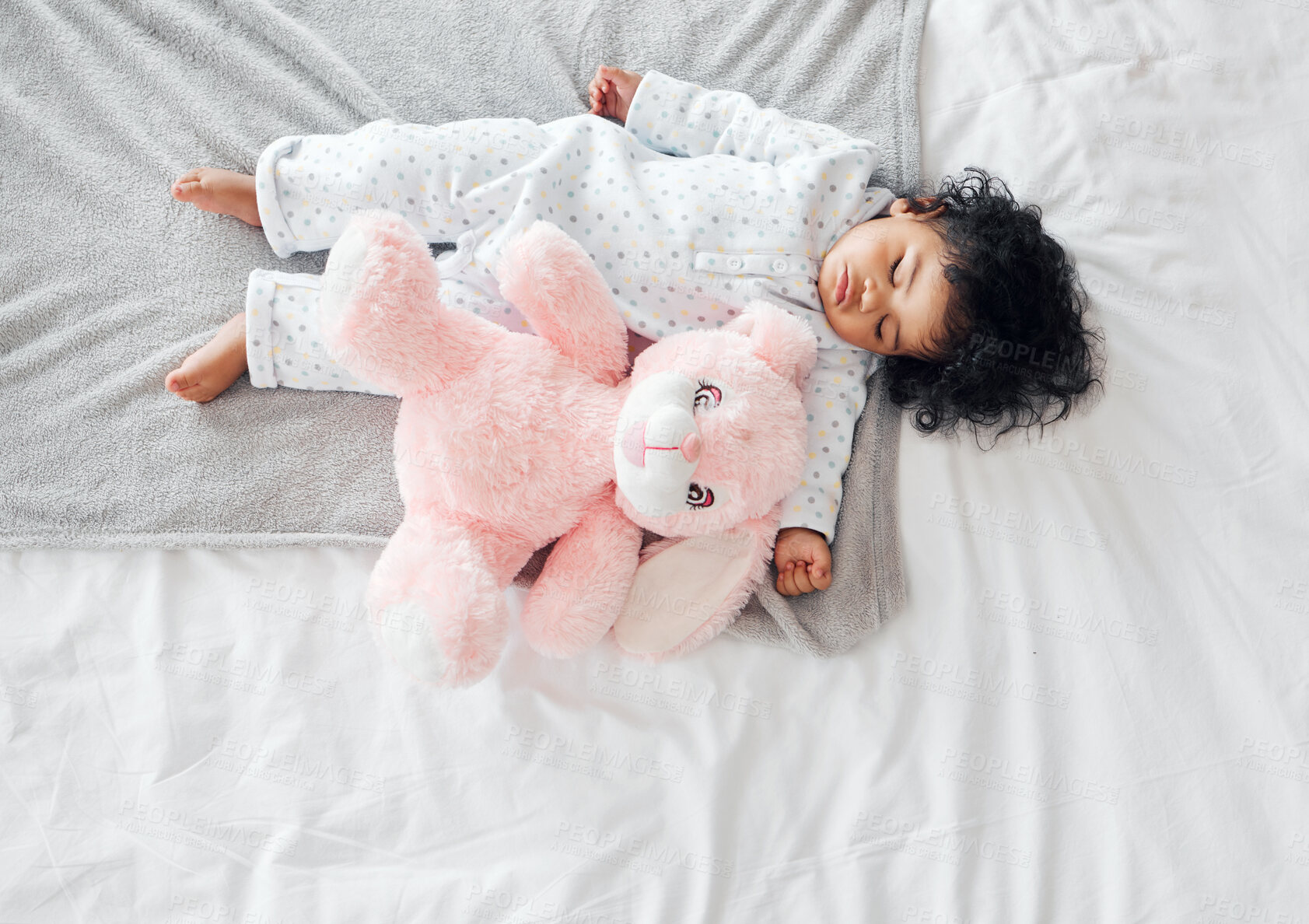 Buy stock photo Bed, baby and teddy bear in nursery for sleeping, dreaming and comfortable with rest for development. Home, relax and girl with fluffy toy for cuddle, peaceful nap and growth for tired child in house