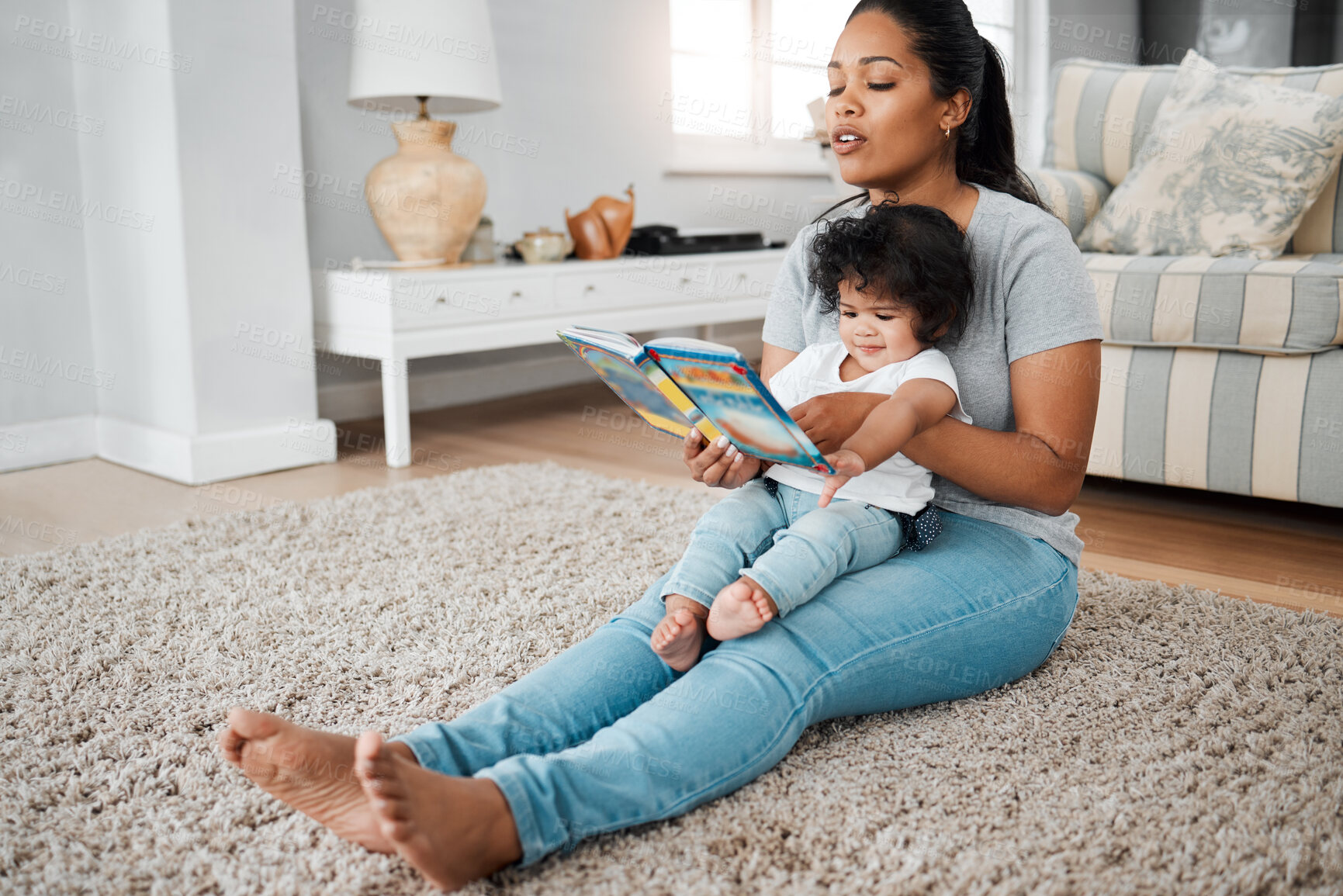 Buy stock photo Mother, baby and reading with book for story, bonding or early childhood development on floor at home. Mom, child or young kid with novel for learning, education or fairy tale in living room at house