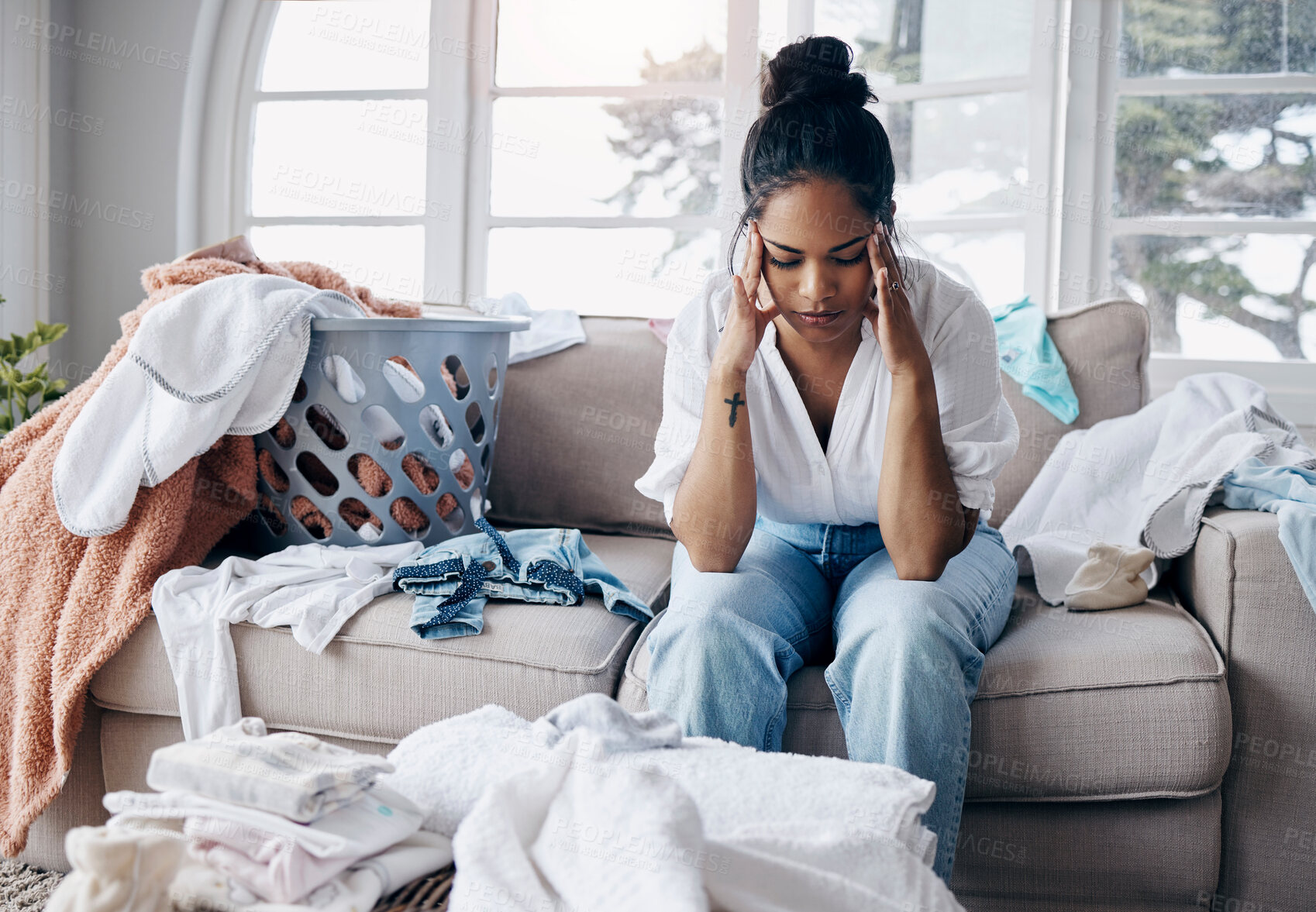 Buy stock photo Fatigue, headache and woman on sofa with laundry, housework schedule and chaos in washing. Stress, tired and exhausted female person on couch in living room with chores, cleaning and thinking in home