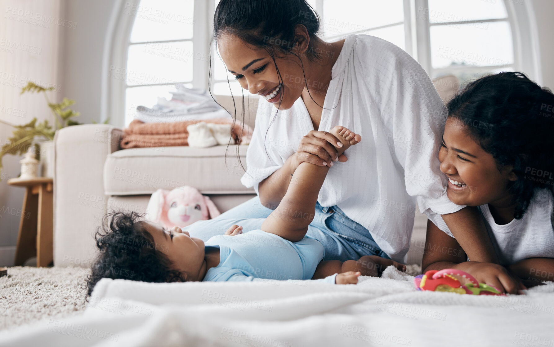 Buy stock photo Kids, mom or baby on floor playing for child development, support or care in family home. Siblings, fun games or toddler with smile, happy parent or mother for bonding, wellness or love with health