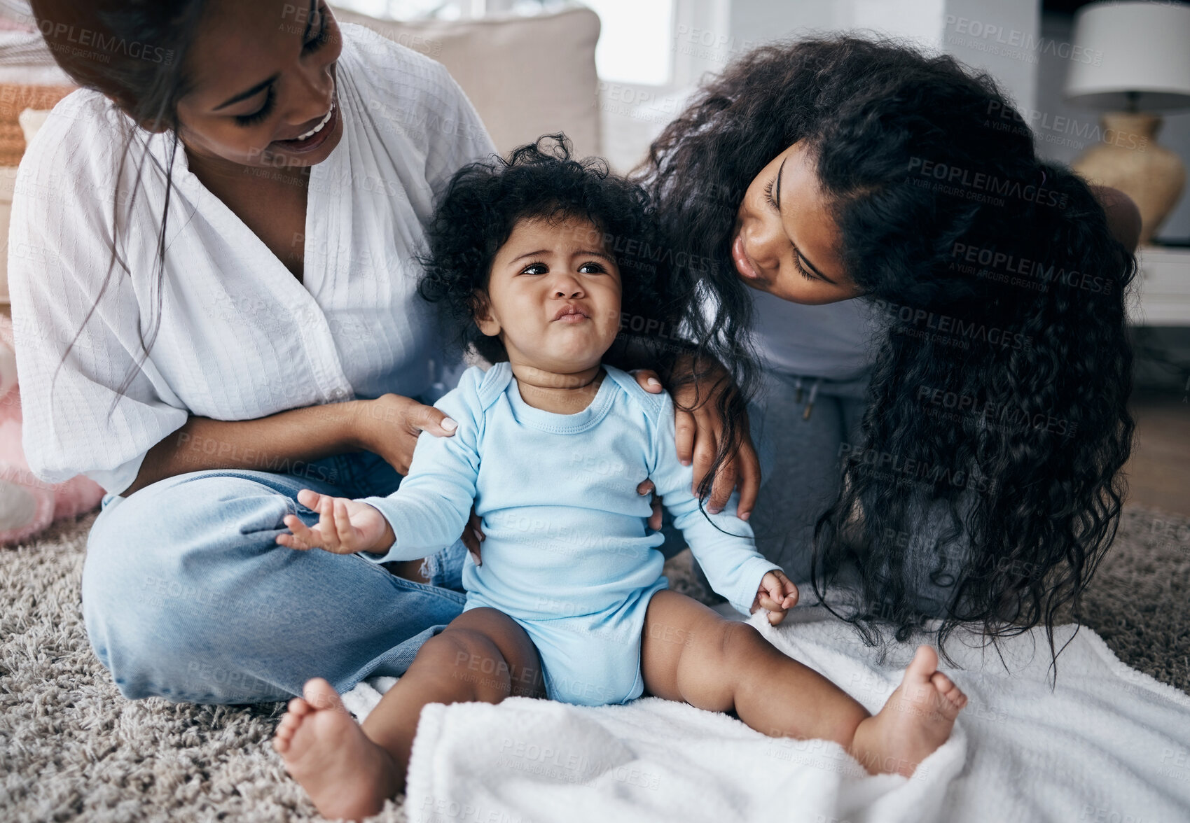 Buy stock photo Mother, baby and female siblings for bonding, development and playing together with moody or grumpy. Mom, toddler and sad little girl in home for support, growth and happy family with care or love