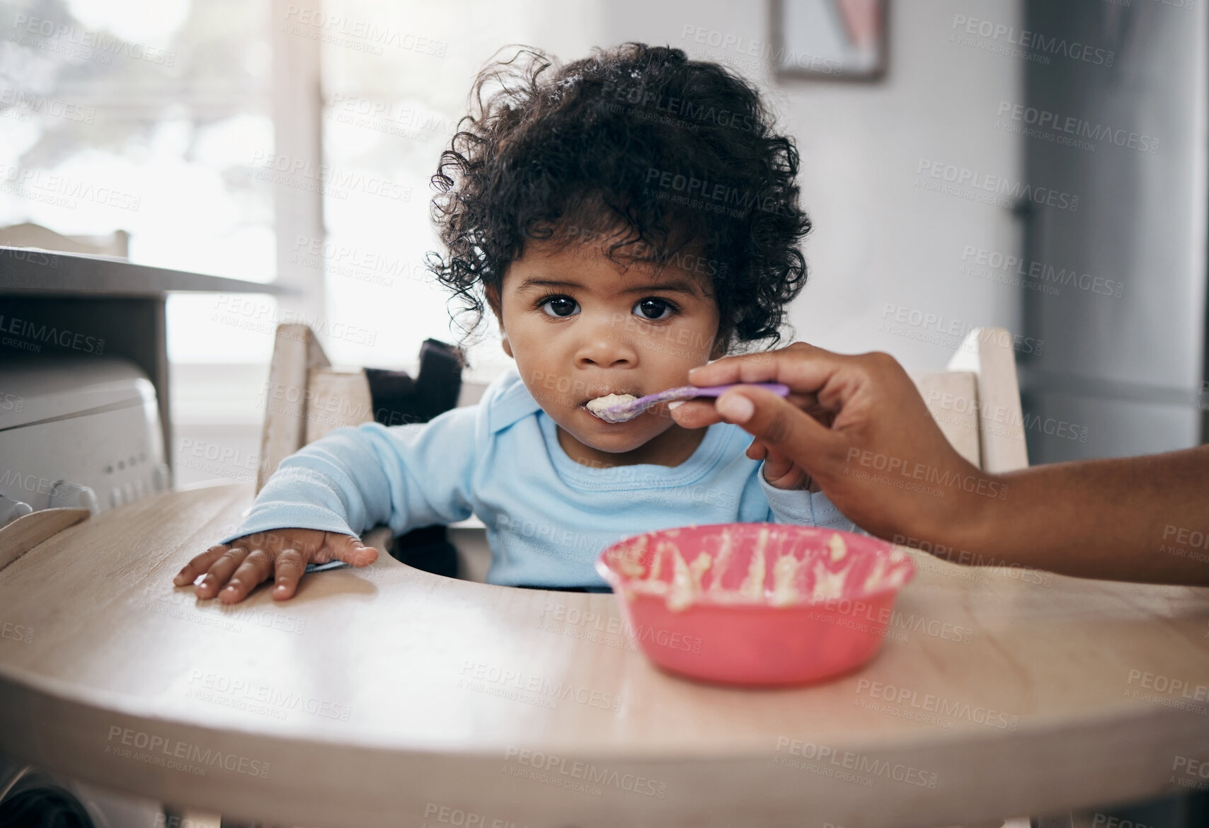 Buy stock photo Baby portrait, parent hands and porridge in home, breakfast and nutrition for healthy growth. Mama, daughter and support in child development for wellness, organic formula and love for kid with fiber