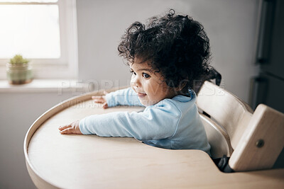 Buy stock photo Baby, girl and relax in kitchen chair, child development and waiting for breakfast feeding. Toddler, kid and resting in home for lunch or ready for meal, morning weekend and infant for wellness