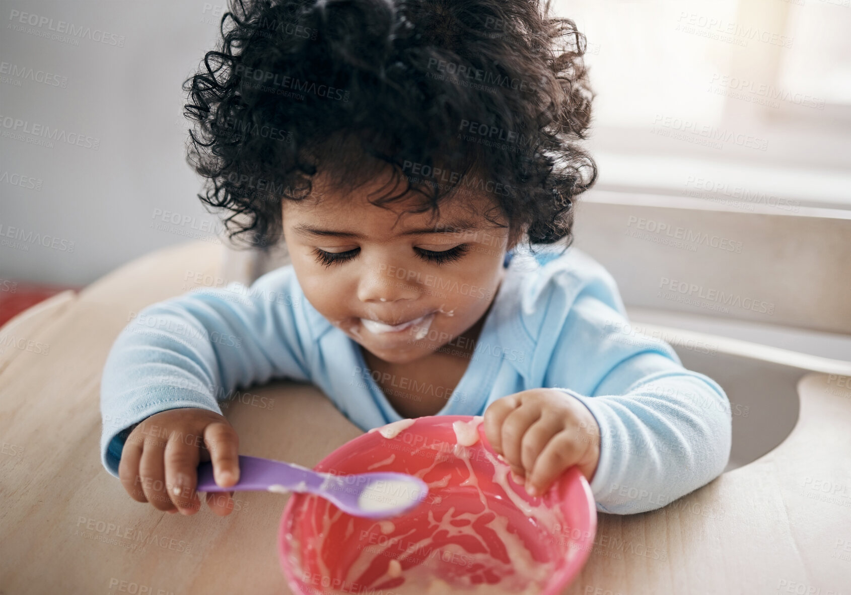 Buy stock photo Home, baby and hungry with cereal for eating, nutrition and growth development with food for wellness. Chair, motor skills and child with porridge for digestive health, spoon and breakfast in morning