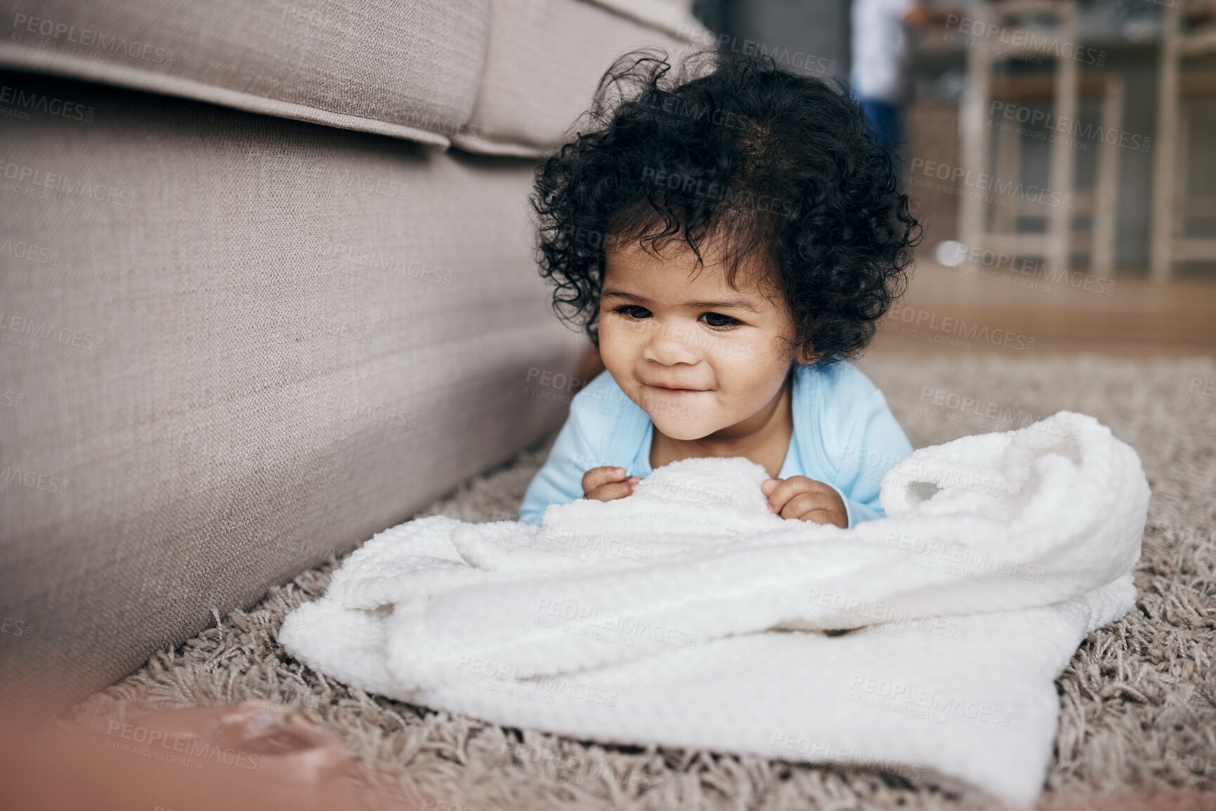 Buy stock photo Home, happy baby and playing with blanket for comfort, security and child development on carpet. Smile, infant and relax with growth, learning and mobility in living room for motor skills and posture