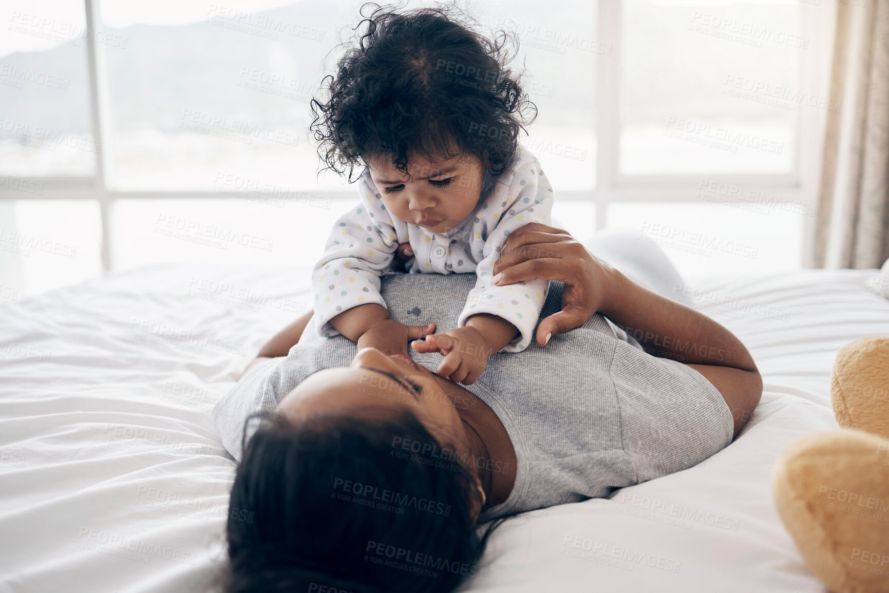 Buy stock photo Bonding, mother and playing with baby on bed for affection, child development and morning routine in home. Parenting, woman and infant in bedroom for support, trust and relationship with security