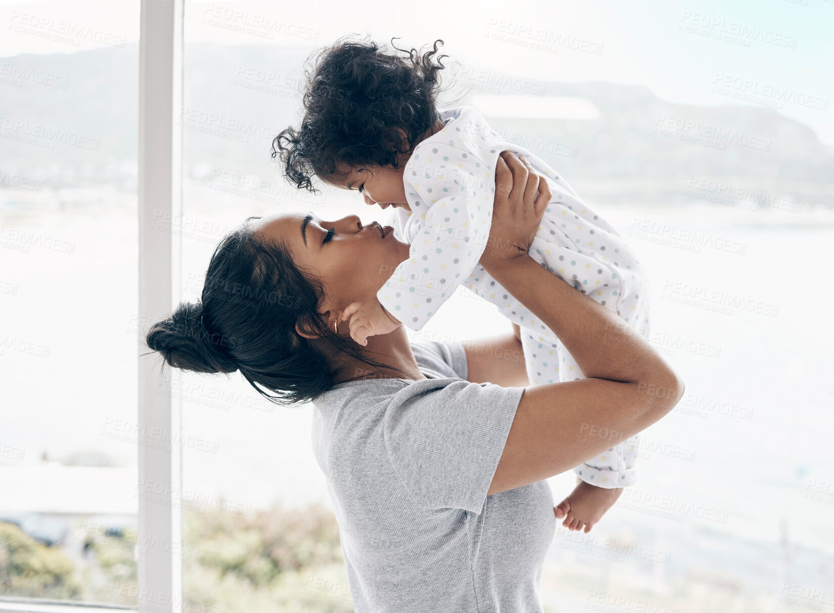 Buy stock photo Bonding, mother and kiss baby by window for playing, child development and morning routine in home. Parenting, woman and infant in bedroom with affection, protection and relationship with connection