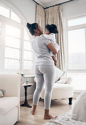 Buy stock photo Support, mother and bonding with baby in home for protection, child development or morning routine. Parenting, woman and carrying infant in lounge with safety, comfort or relationship with connection