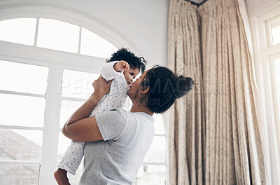 Buy stock photo Kiss, mother and bonding with baby in home for protection, child development and morning routine. Affection, woman and carrying infant by window with safety, support and relationship with connection