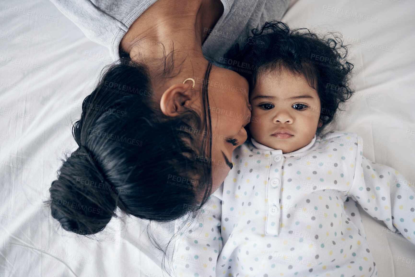 Buy stock photo Bonding, mother and kiss baby on bed for affection, child development and morning routine with love. Top view, woman and infant in bedroom with support, protection and relationship with connection