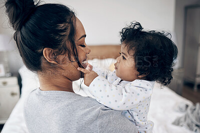 Buy stock photo Love, mother and bonding with baby in home for protection, child development and morning routine. Parenting, woman and carrying infant in bedroom with smile, support and relationship with connection