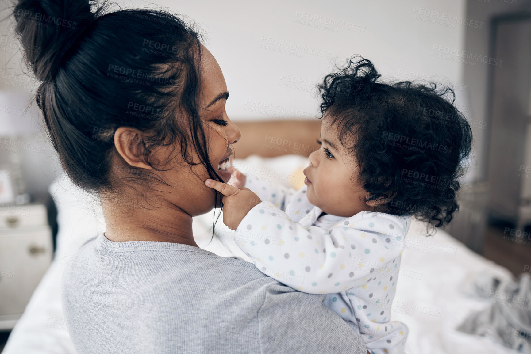 Buy stock photo Love, mother and bonding with baby in home for protection, child development and morning routine. Parenting, woman and carrying infant in bedroom with smile, support and relationship with connection