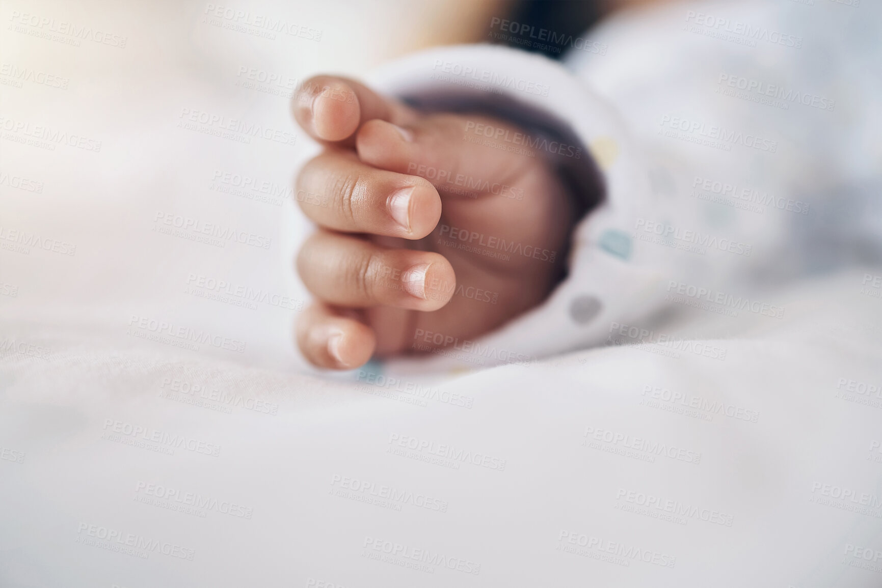Buy stock photo Baby, sleeping and closeup of hands on bed for child development, growth and comfortable in nursery. Newborn, tired and rest in home for morning routine, nap and dreaming with wellness and security