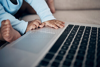 Buy stock photo Closeup, hands and baby with laptop in home, playing and online for streaming entertainment. Child, infant feet and relax on couch for cartoon movies, living room and wireless internet for film