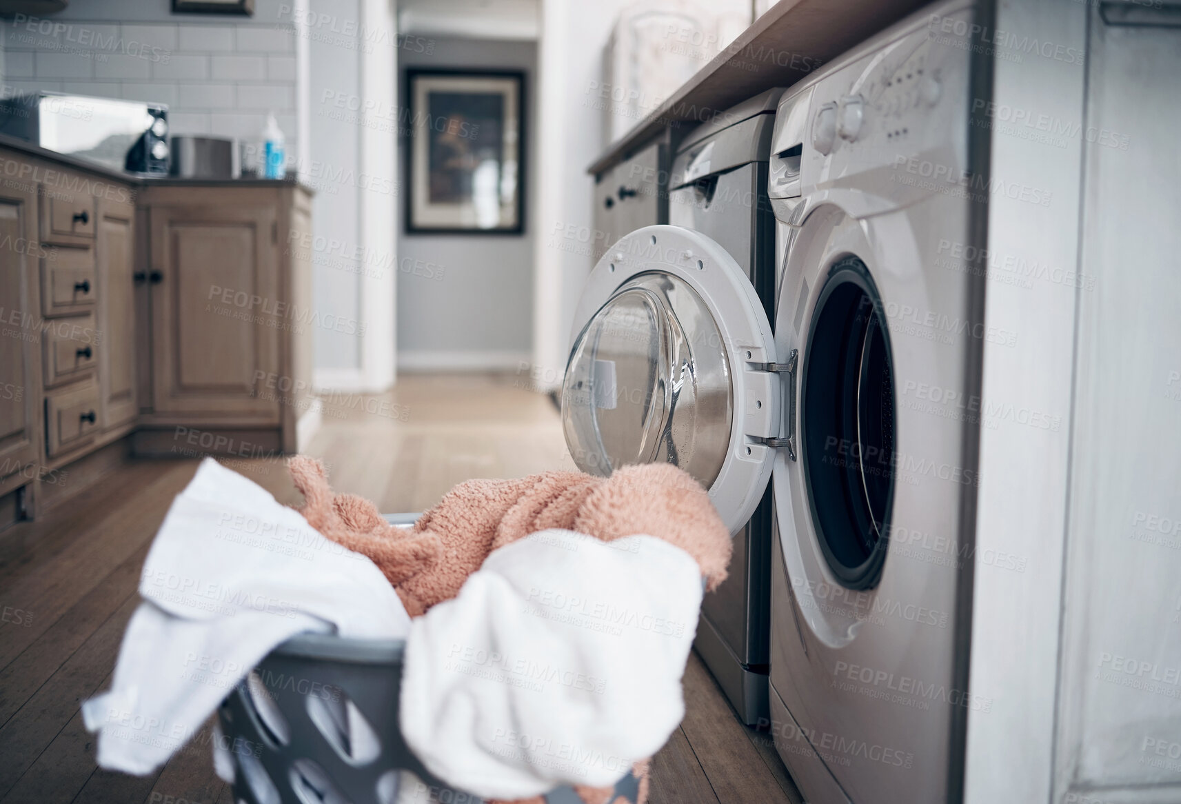 Buy stock photo Empty room, laundry and clothes by washing machine for housekeeping, cleaning routine and domestic chores. Hygiene, housework and fresh linen in basket for responsibility and dry fabric in apartment
