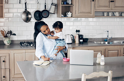 Buy stock photo Shot of a young mother feeding her baby while using a laptop at home