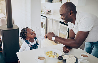 Buy stock photo Shot of a father and daughter bonding at home