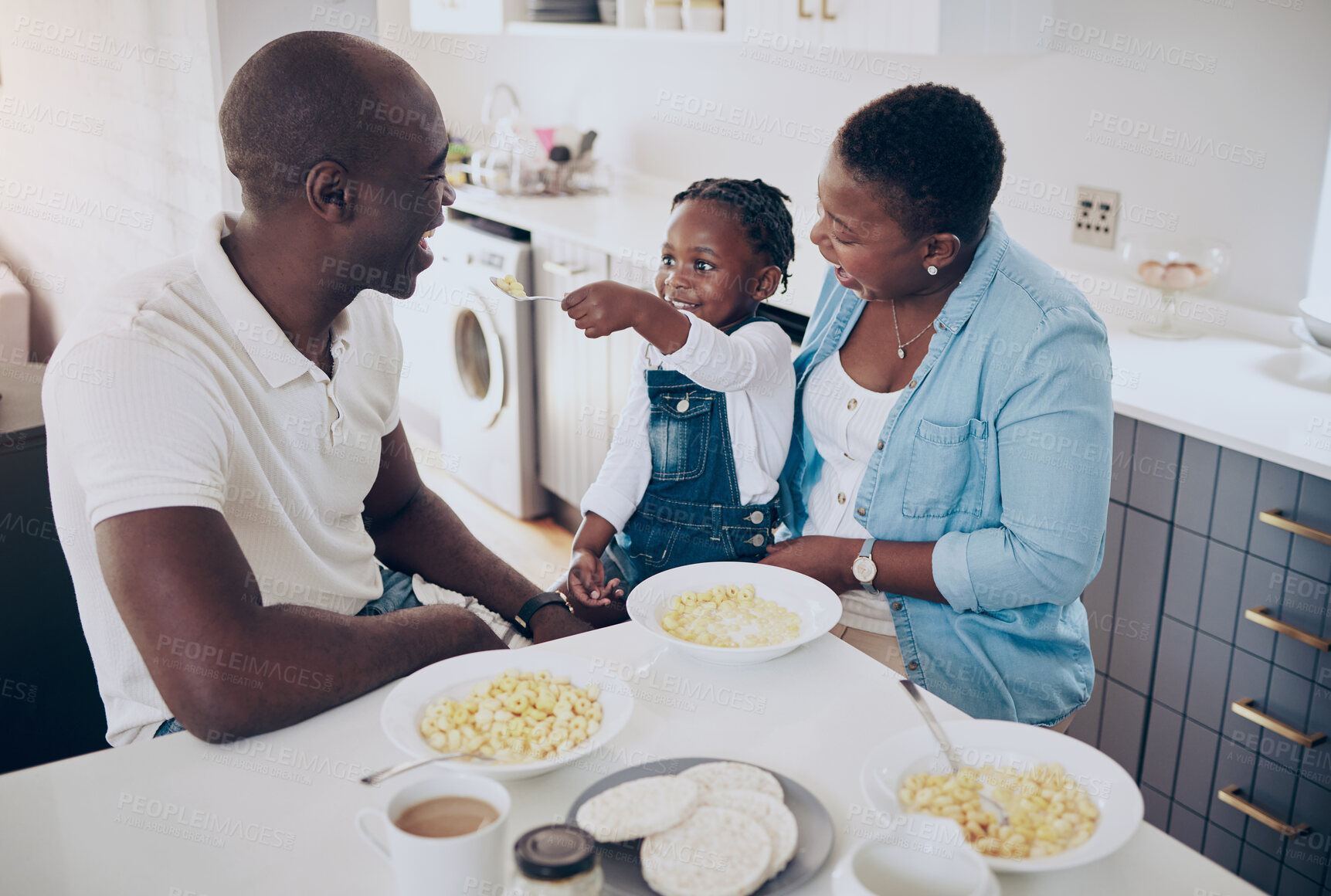 Buy stock photo Black people, parents and child with food for feeding, eating breakfast and bonding together as family. Home, father and mother with girl for cereal, nutrition and wellness in morning for development
