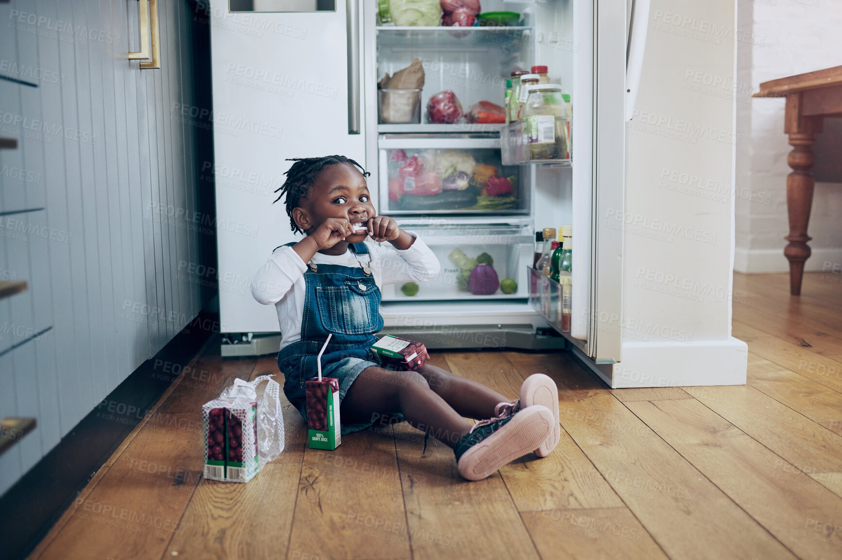 Buy stock photo Portrait, girl and child by fridge for snack, juice or drinking beverage in house alone on floor. Kitchen, naughty and thirsty African kid in home for mischief or lunch in refrigerator with straw