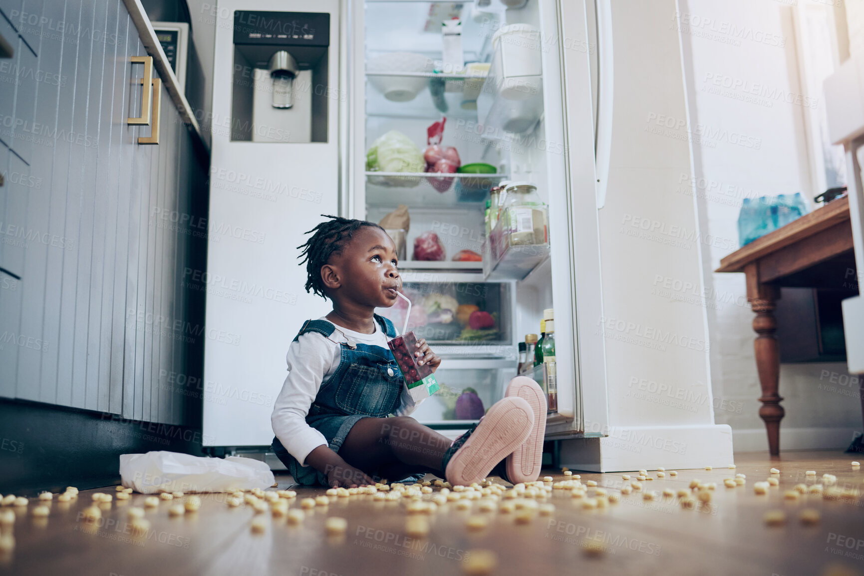 Buy stock photo Home, girl and child by fridge for snack, juice or drinking beverage alone on messy or dirty floor. Popcorn, naughty and thirsty African kid in house kitchen for meal, hunger or lunch in refrigerator