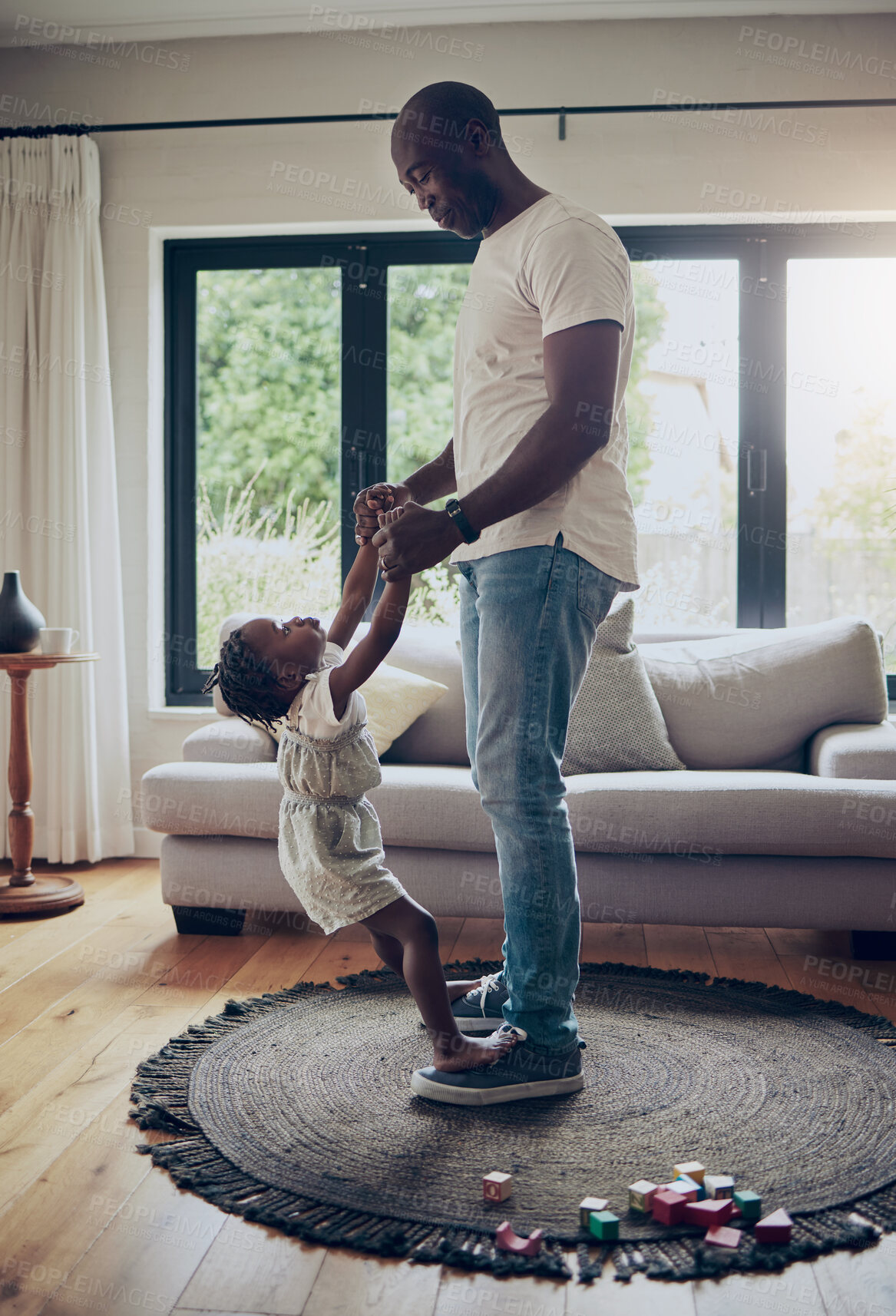 Buy stock photo Father, daughter and dancing on feet in home for teaching moves, bonding together or trust with rhythm. Black family, man or kid dancer with balance on shoes for learning steps, support or childhood