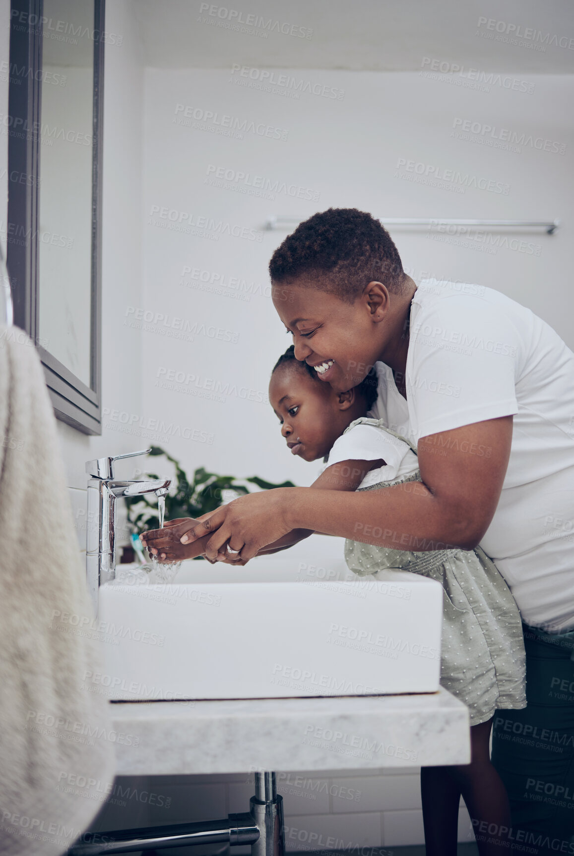 Buy stock photo Black family, mother and girl washing hands in home, clean water and help to remove dirt or germs. Mom, daughter and teaching self care or how to prevent disease in bathroom, support and skincare